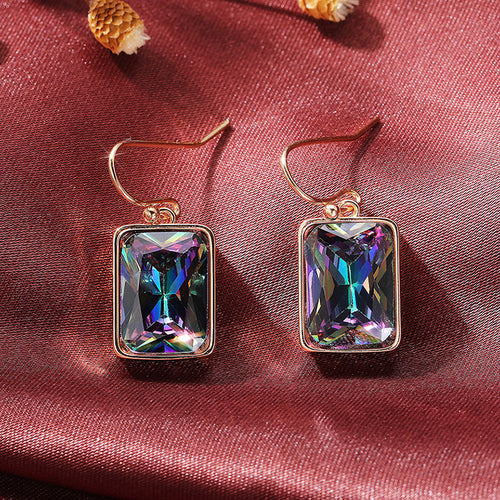 Pair of multicolor rectangle earrings on pink satin