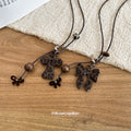 Brown Leopard Bow and Cross Pendant Necklace on Black Cord view 4