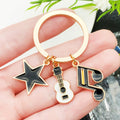 Four Guitar Keyboard and Headphone Metal Keychain Designs view 1