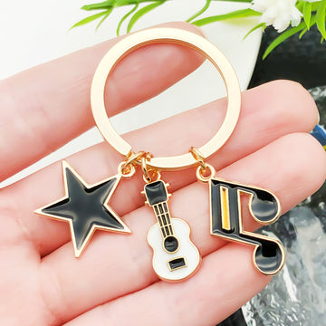 Four Guitar Keyboard and Headphone Metal Keychain Designs