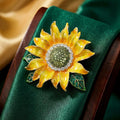 Sunflower Brooch In Metal With Yellow Enamel Petals, Green Leaves, And A Crystal Center view 2