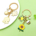Bee and Honeycomb Charm Keychains Featuring Butterfly Across 33 Pictured Variations view 3