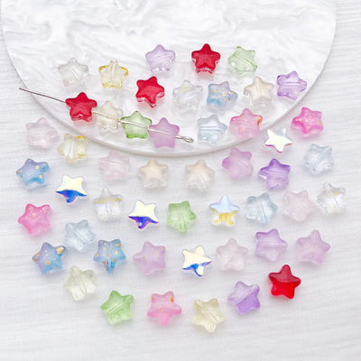 Five point star glass beads in twelve colors arranged as a full product overview