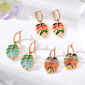 Gold Tone Enamel Monstera Leaf Huggie Earrings in Three Colors view 1