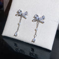 Crystal Bow and Pearl Tassel Drop Earrings in Silver Tone view 6