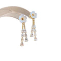 White Flower Crystal Tassel Earrings with Gold Tone Details view 5