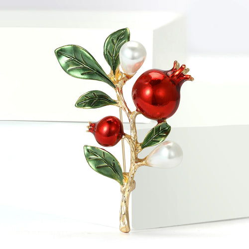 Pomegranate pin angled on white stepped display blocks