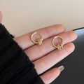 Crystal Huggie Hoop Earrings in Gold and Silver Tones view 7