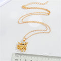 Gold Tone Crystal Octopus Pendant Necklace with Textured Tentacles view 2