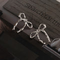 Polished Ribbon Bow Stud Earrings in Gold and Silver view 7