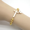 Gold Bead Stretch Bracelet Flat Cross and Round Disc Charm view 1