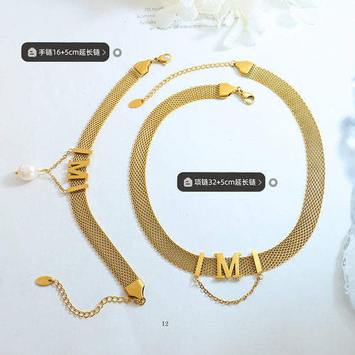 Gold M mesh necklace and pearl bracelet flat with length labels