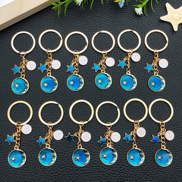 Six Blue Zodiac Moon and Star Metal Keychain Designs