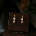 Gold Tone White Pearl And Pink Round Stone Stud Earrings view 1