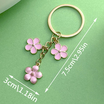 Dimension graphic showing rose, sunflower and blossom keychains with printed 3cm\1.18in measurements.
