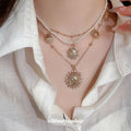 Layered Gold Sun Pendant Pearl Multi Strand Necklace view 1