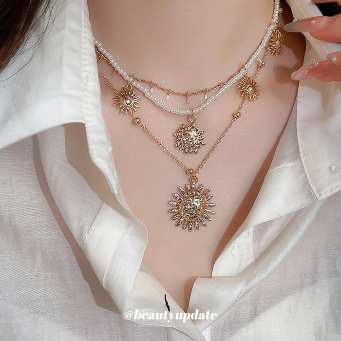 Layered Gold Sun Pendant Pearl Multi Strand Necklace
