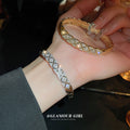 Crosshatched Crystal Hinged Bangle In Gold Tone Or Silver Tone view 3