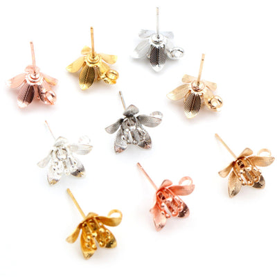 Layered flower-shaped earring post with a lower hanging loop in a group view on a white background