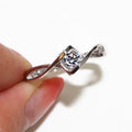 Round Clear Solitaire Twisted Ribbon Ring In Silver Tone view 2