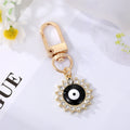 Gold Tone Crystal Heart and Sun Evil Eye Clip Keychains view 4