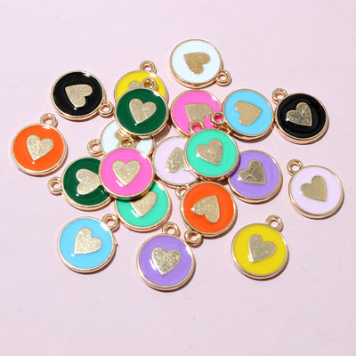 Enamel heart charms showing assorted shapes and finishes