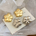 Polished Five Petal Flower Stud Earrings in Gold and Silver view 2
