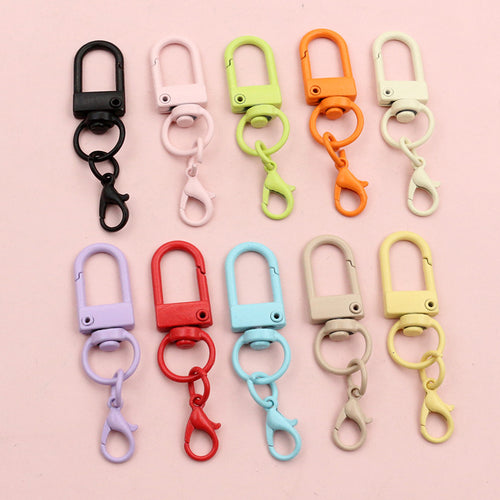 colorful u shaped swivel clasps arranged together on a white background