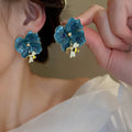 Blue Floral Statement Stud Earrings With Polished Metal Tone Details view 6