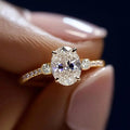 Oval Clear Solitaire Three-Stone Ring In Polished Gold Tone view 2