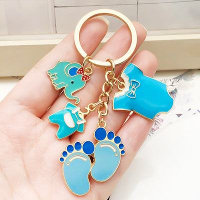 Overview showing the available color and design variations of the blue and pink baby elephant footprint metal keychain