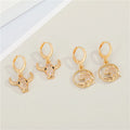 Gold Tone Crystal Animal Huggie Drop Earrings in Two Designs view 1