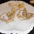 Three Mixed Gold Tone Butterfly And Flower Open Arm Cuff Designs view 2