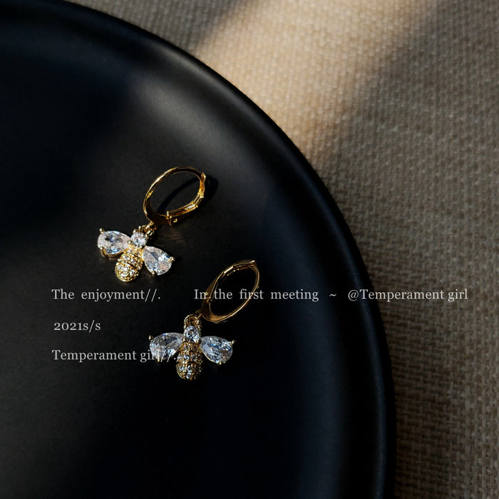 Gold Tone Huggie Hoop Earrings With Clear Stone Bee Drops
