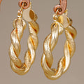 Braided Oval Hoop Earrings in Gold-Tone Metal Jewelry view 1