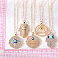 Gold Tone Crystal Egyptian and Hamsa Evil Eye Pendant Necklaces view 5