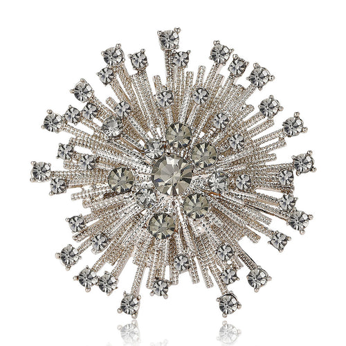 Front view of round starburst composed of radiating rows of clear stones