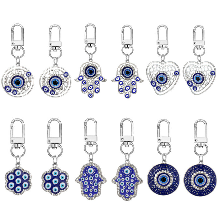 Twelve Piece Silver Tone Hamsa Heart and Evil Eye Keychain Set