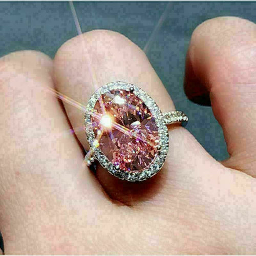Second product view showing silver-tone pink oval solitaire halo ring