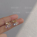 Gold Tone Bow And Iridescent Faceted Twin Drop Stud Earrings view 1