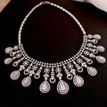 Silver Tone Floral Teardrop Earrings and Statement Necklace view 7