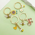 Bee and Honeycomb Charm Keychains Featuring Bee Across 10 Pictured Variations view 1