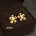 Gold Textured Flower Stud Earrings Clear Crystal Center view 1