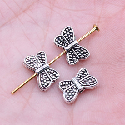 Front display of butterfly bead on a light background