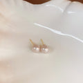 Pink Pearl Stud Earrings with Gold Tone Posts with Polished Metal Accents view 6