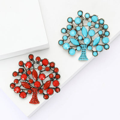 Round Gemstone Tree Brooch shown against a white display background