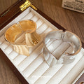 Sculptural Flared Wide Hinged Cuff In Gold Or Silver Tone Finishes view 2