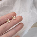 Gold Tone Matte Mini Four Petal Flower Stud Earrings For Women view 1