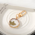 Gold Tone Irregular Round Pressed Flower Resin Clip Keychains view 11