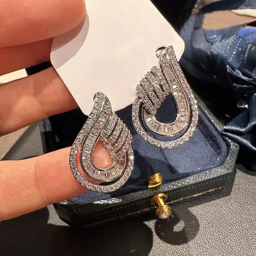 Layered Open Teardrop Clear Stone Earrings Metal Jewelry Design shown from an alternate angle